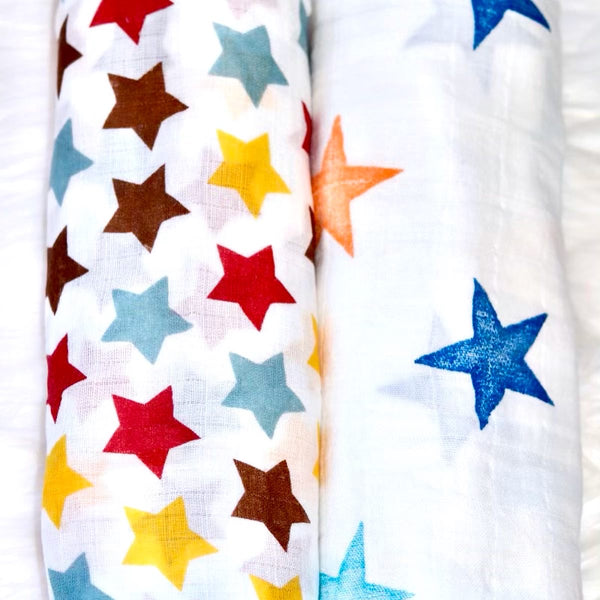 Reach for the Stars Muslin cotton swaddle set . Two muslin swaddles, one large star pattern, one small star pattern.