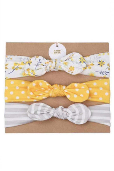 Stretchy grow-with-me set of three coordinating infant headbands with center bow, bright yellow polka dot, gray and white stripe, white and yellow floral.